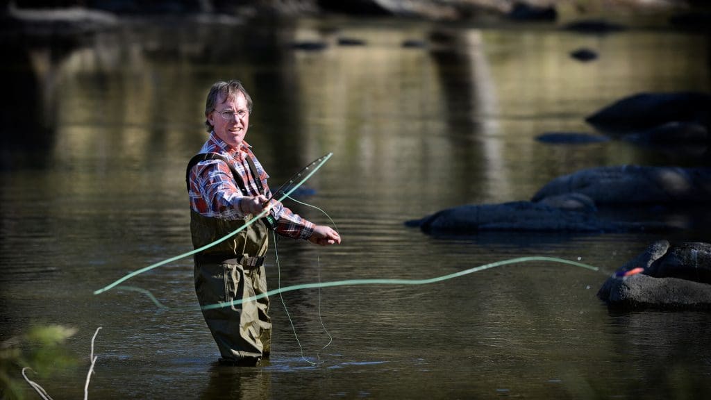 Man fly fishing in river near Manilla